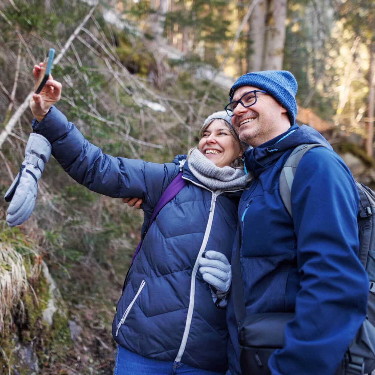 A couple take a selfie while hiking